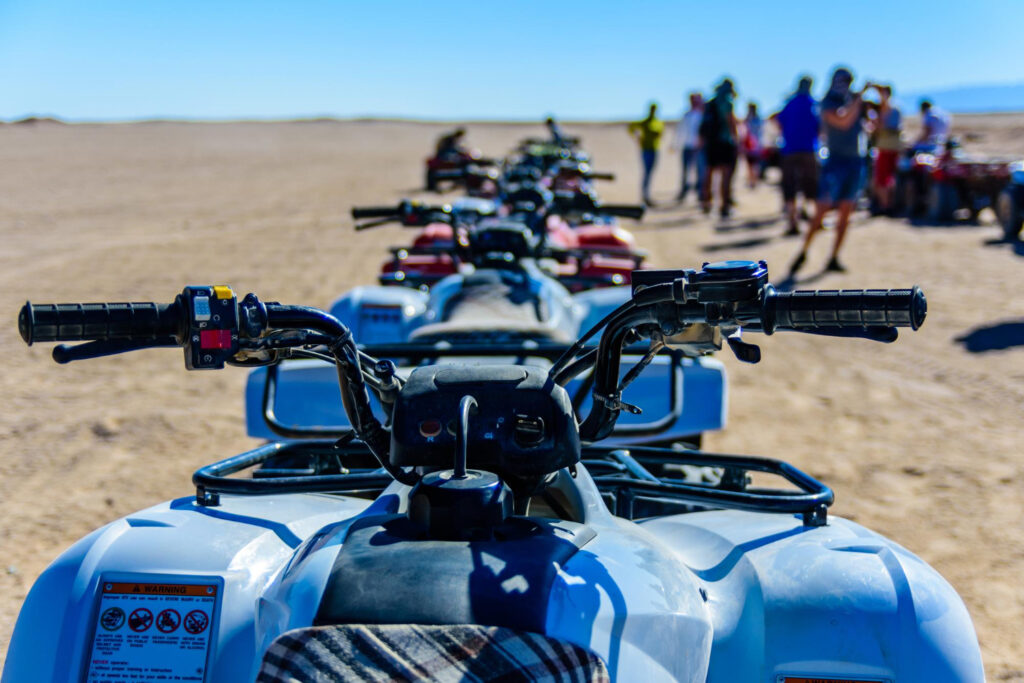 Hurghada Super Safari with quad biking, dune buggy ride, camel trek, Bedouin village visit, BBQ dinner, Tanoura and belly dance show